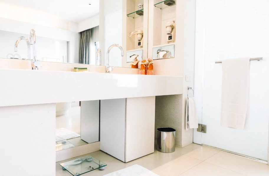 Modern white bathroom remodel with double sink vanity showing bathroom remodel cost in Ventura County