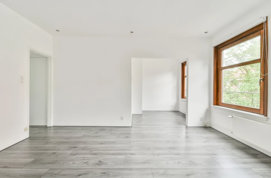 Newly completed room addition with white walls and laminate flooring highlighting room addition cost in Ventura County